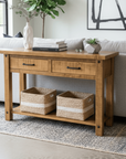 Wooden console table with two baskets in a living room setting