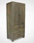 A rustic Backwoods Armoire made from solid wood with a Millsawn texture, featuring doors, drawers, and a standard pull handle.