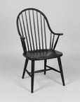 Black wooden chair with spindle back on a white background