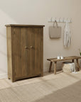 Wooden cabinet with two doors on a white background