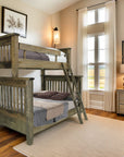Wooden bunk bed in a bedroom with a window and decor.