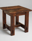 Wooden side table with a dark brown finish on a white background