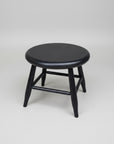 Black wooden stool on a white background