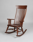 Wooden rocking chair on a concrete surface