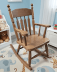 Wooden rocking chair in a child's room with toys and a colorful rug.