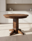 A round Shaker Single Pedestal Table made of Canadian solid wood, displaying a smooth wood texture finish.