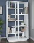 White bookshelf with decorative items against a blue wall