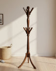 Wooden coat stand with multiple hooks on a gray background