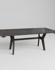A sleek, mid century modern avenue dining table made of solid wood with a dark windswept texture, handcrafted in Canada.