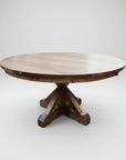 A round Brewster Pedestal Table with a wood finish and a sturdy X base style pedestal support.