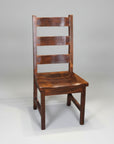 A rustic Dakota ladder back side chair made of solid wood, with a visible wood grain and saw marks, standing against a white background.