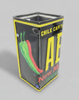 A repurposed New Mexico license plate pencil holder with black, yellow, and green colors, featuring text and a chili pepper graphic.