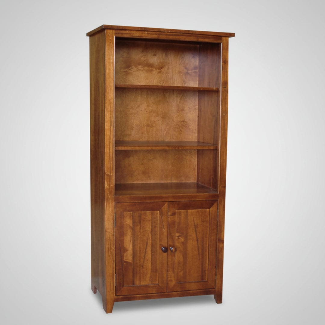 Wooden bookshelf with a door on a gray background