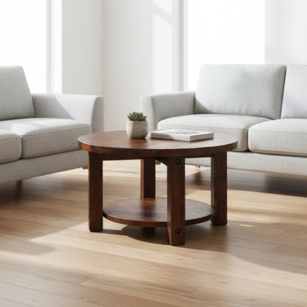 Round wooden table with a dark brown finish on a white background