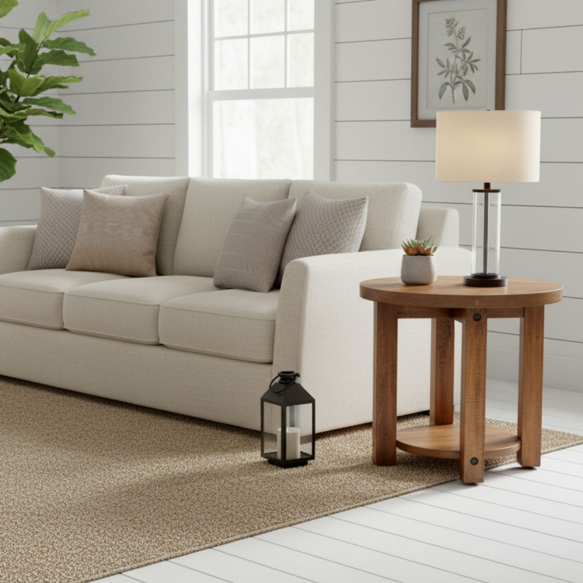 Wooden side table with a round top and shelf on a gray background
