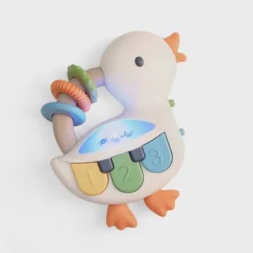 Colorful duck-shaped toy with buttons and a ring on a white background