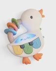 Colorful duck-shaped toy with buttons and a ring on a white background