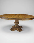 Wooden dining table with a round top and pedestal base on a white background