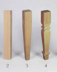 Five wooden furniture legs of different designs and finishes on a white background.