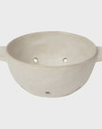 Ivory ceramic berry bowl with handles on a white background