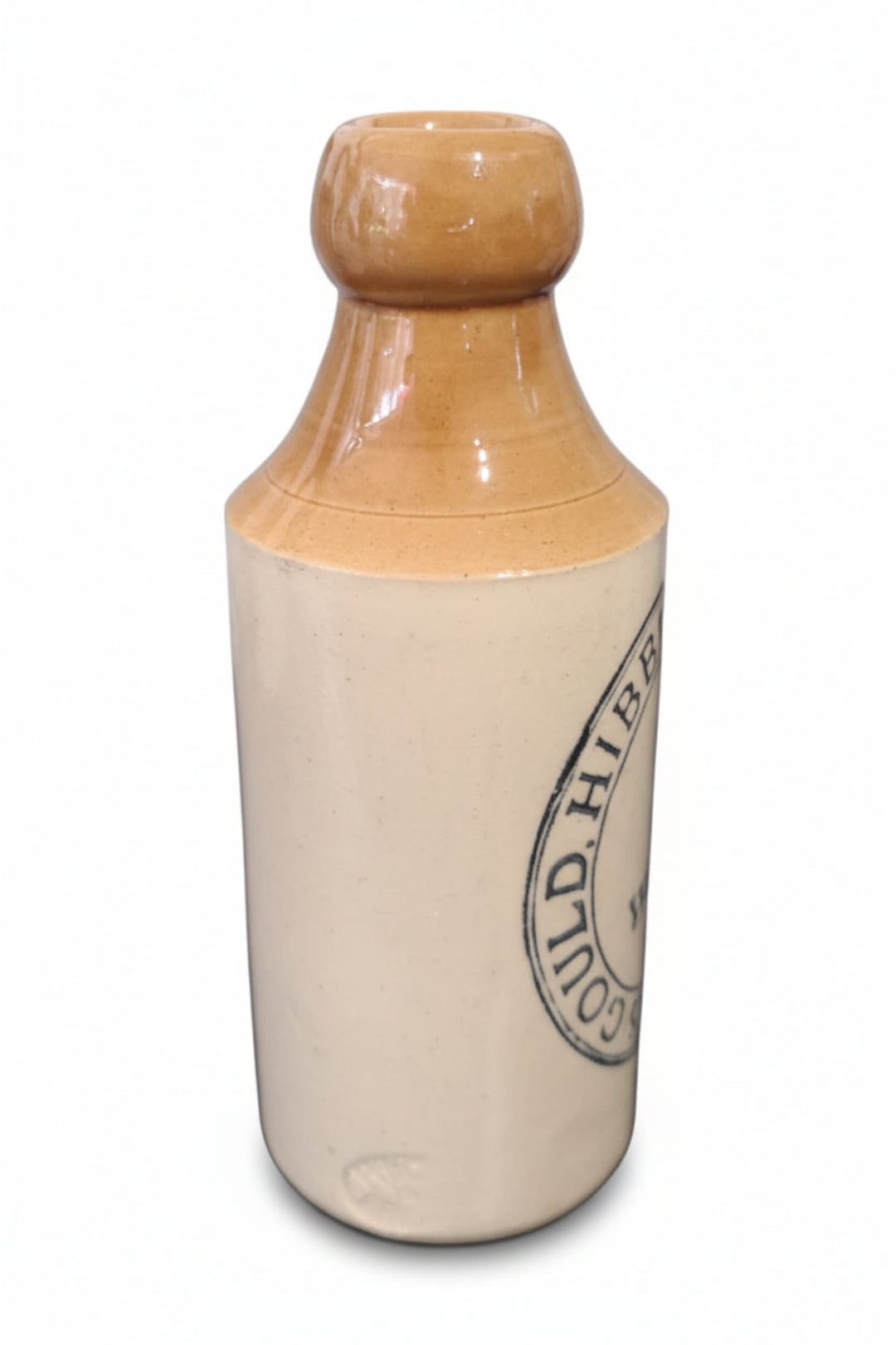 Vintage-style bottle with beige cap and body on a white background