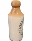 Vintage-style bottle with beige cap and body on a white background