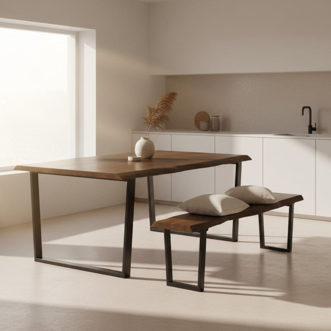 Wooden dining table with black metal legs and matching bench on a white background