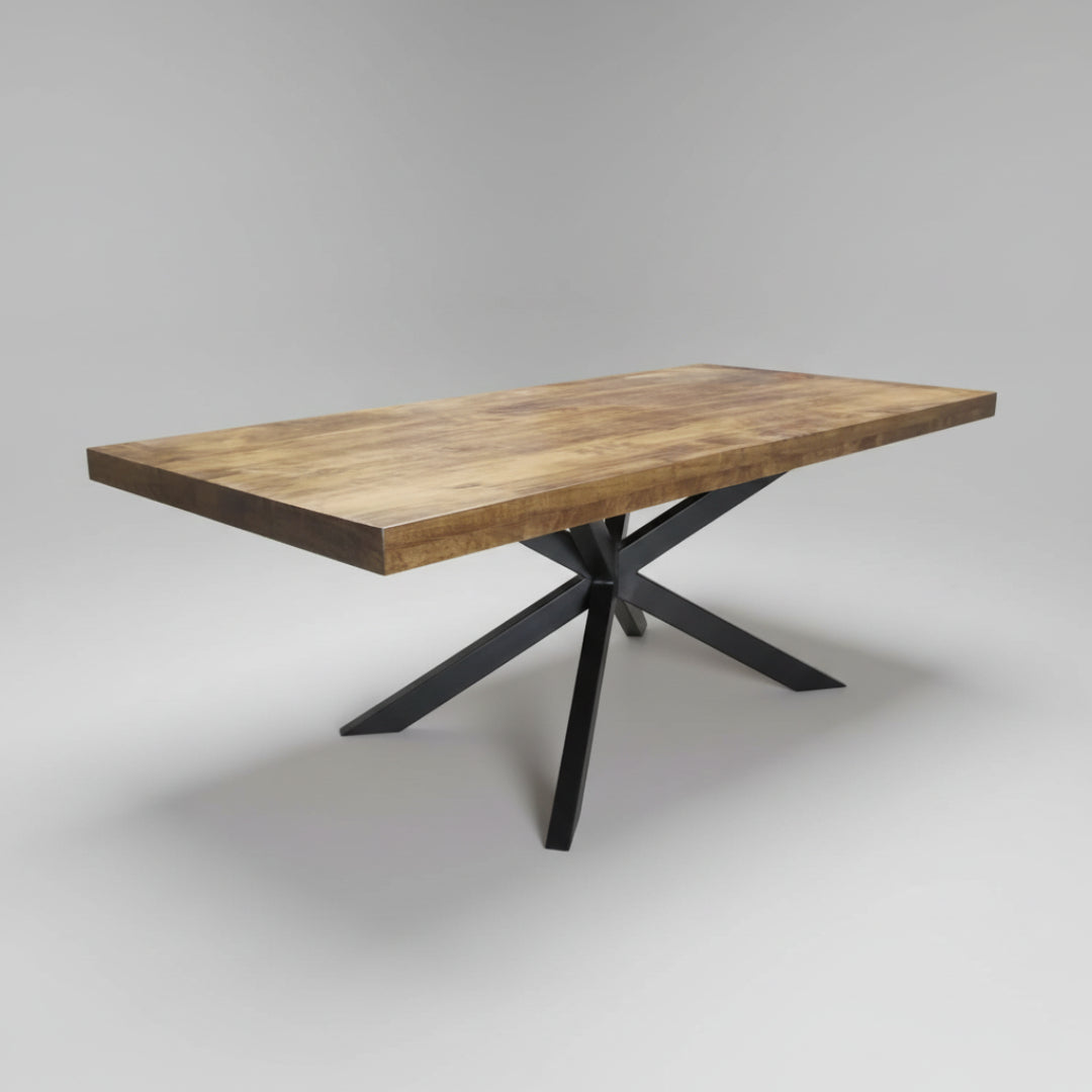 A modern dining table with a black metal base and a natural wood built-up top, showcasing a sleek and contemporary design.