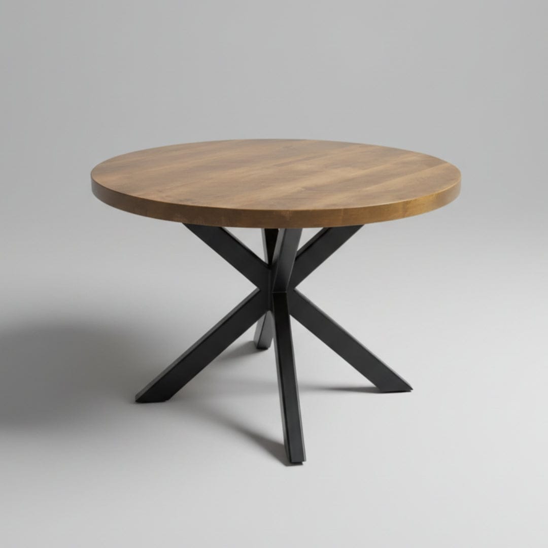 Round wooden table with metal legs on a street