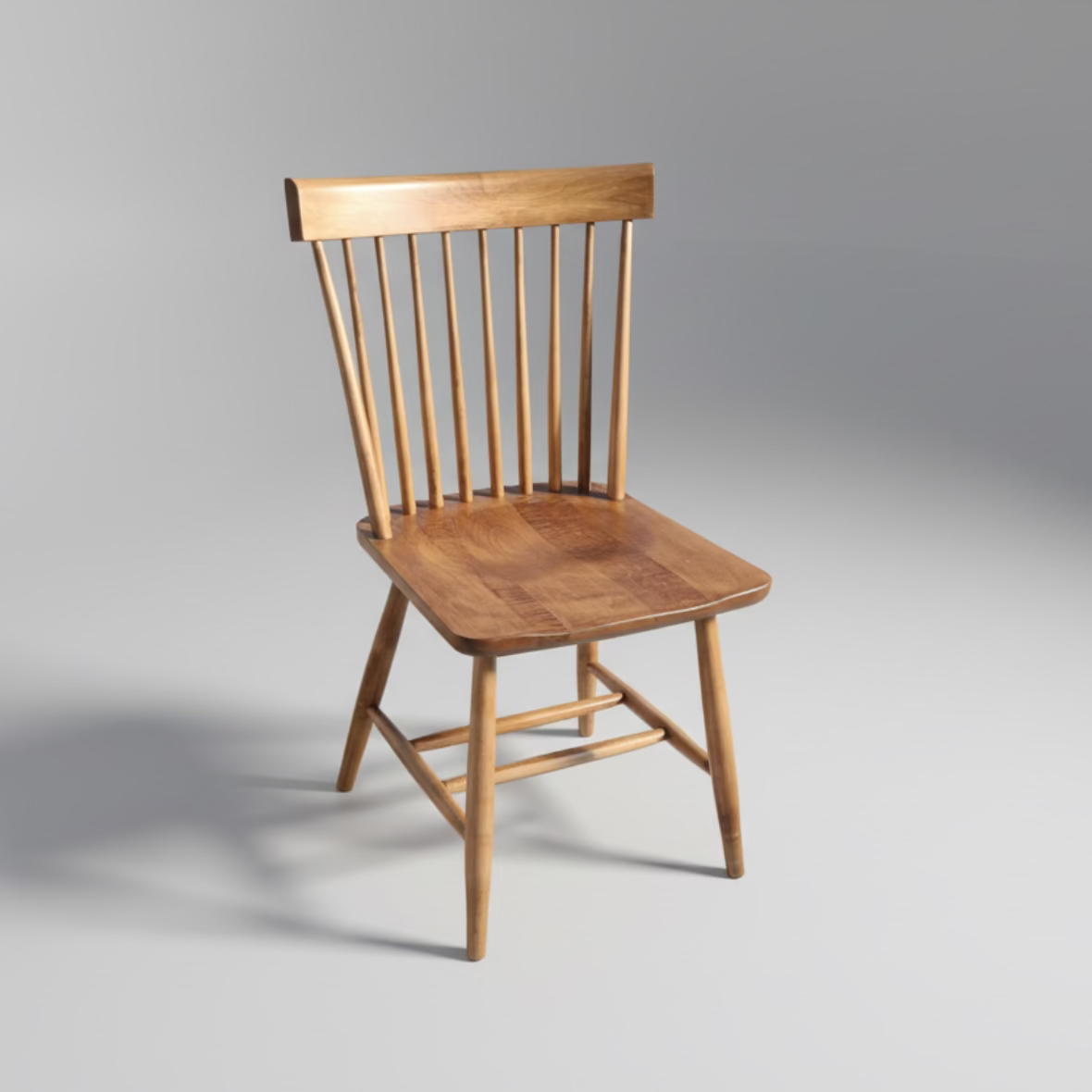 A wooden Modern Shaker Chair with a scooped out seat and a slatted backrest, displayed against a plain background.