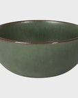 A round ceramic bowl with a matte sage green glaze and a contrasting rustic brown rim, shown against a plain light gray background.