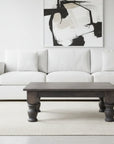 Wooden coffee table with turned legs on a white background