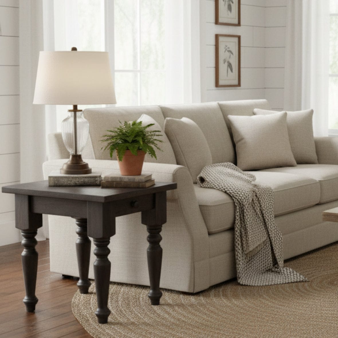 Wooden side table with a single drawer on a white background