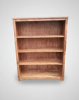 Wooden bookshelf with four shelves on a white background
