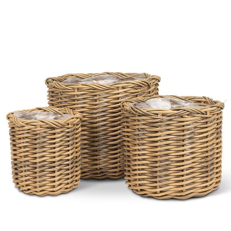 Three woven baskets of different sizes on a white background