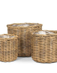 Three woven baskets of different sizes on a white background