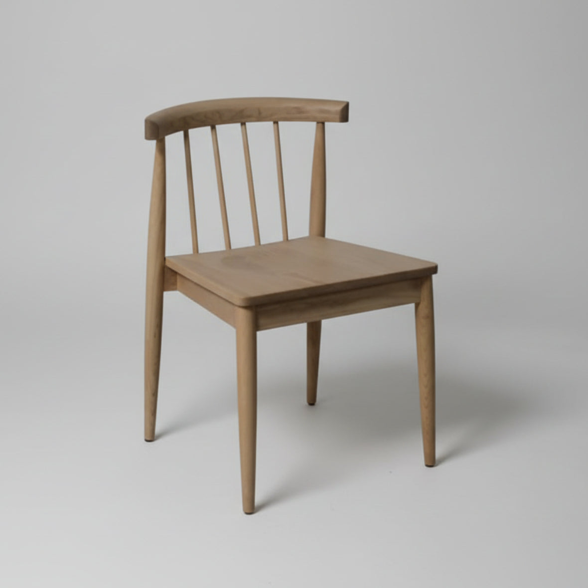 A wooden chair with a smooth seat and backrest, having a modern design.