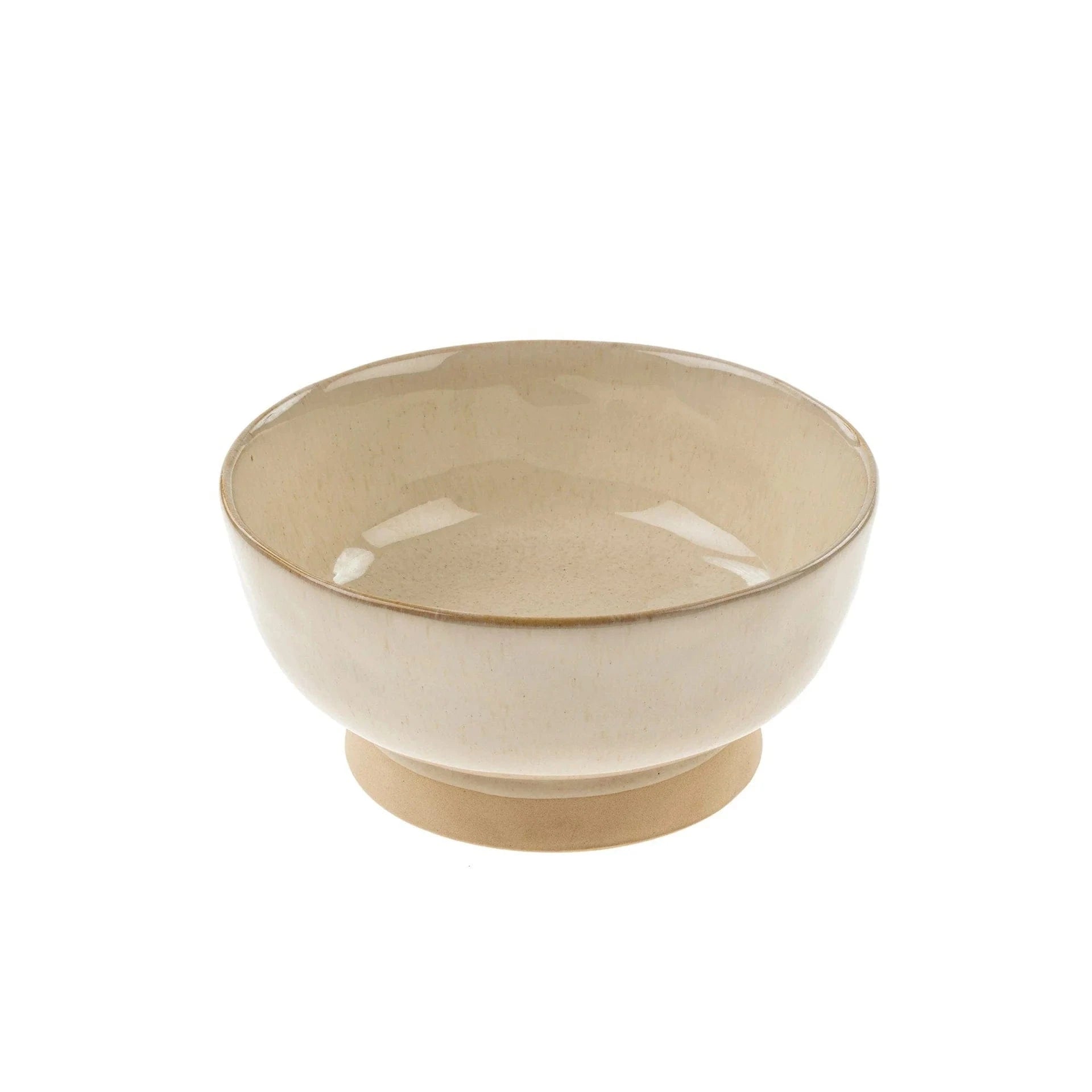 A beige stoneware pedestal bowl with a creamy reactive glaze on the interior and an unglazed pedestal bottom.