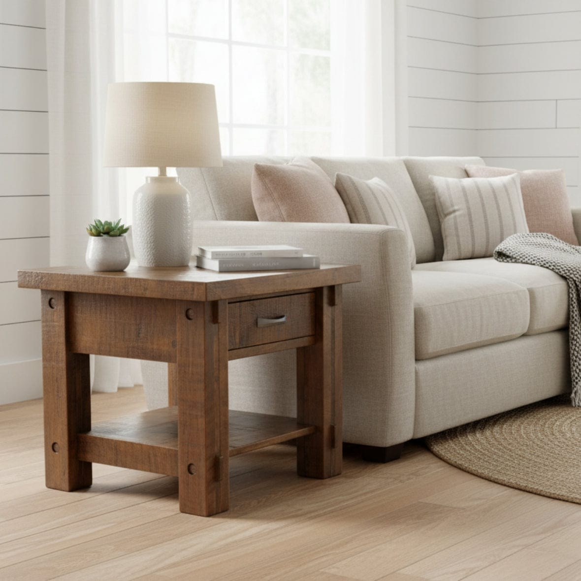 Wooden side table with a drawer on a white background