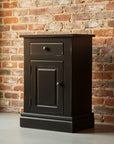 Black wooden nightstand with a drawer on a white background