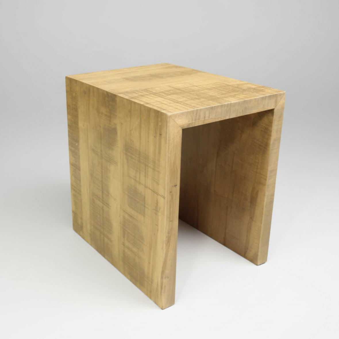 A rustic wooden end table with a visible grain pattern, designed with a simple, solid structure and a rectangular shape.