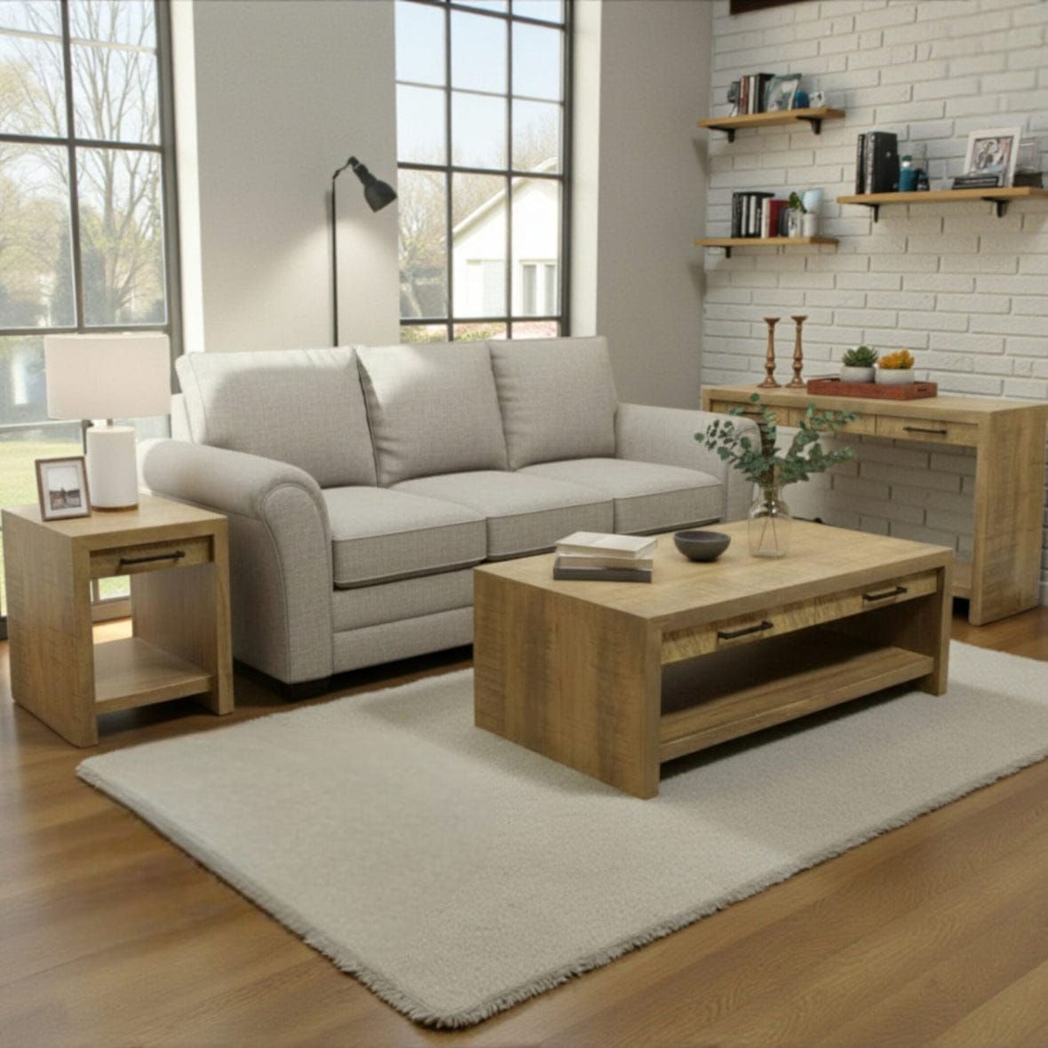 Living room with a gray sofa, wooden coffee table, and shelves.