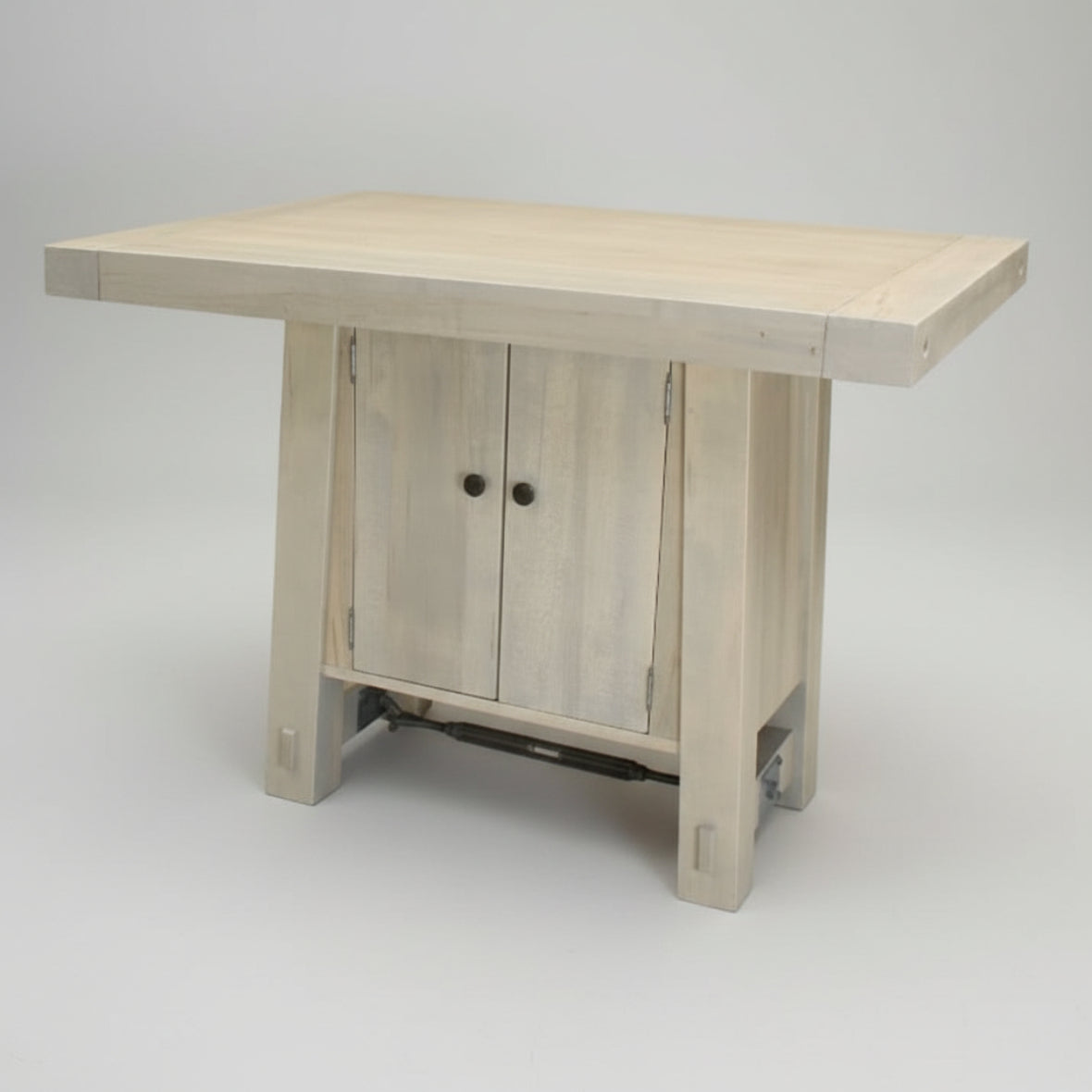 A rustic Yukon 4 Door Island made of solid wood, featuring a white finish and a bolt and turnbuckle accent, with dimensions 38" Deep x 48" Wide x 36" High.