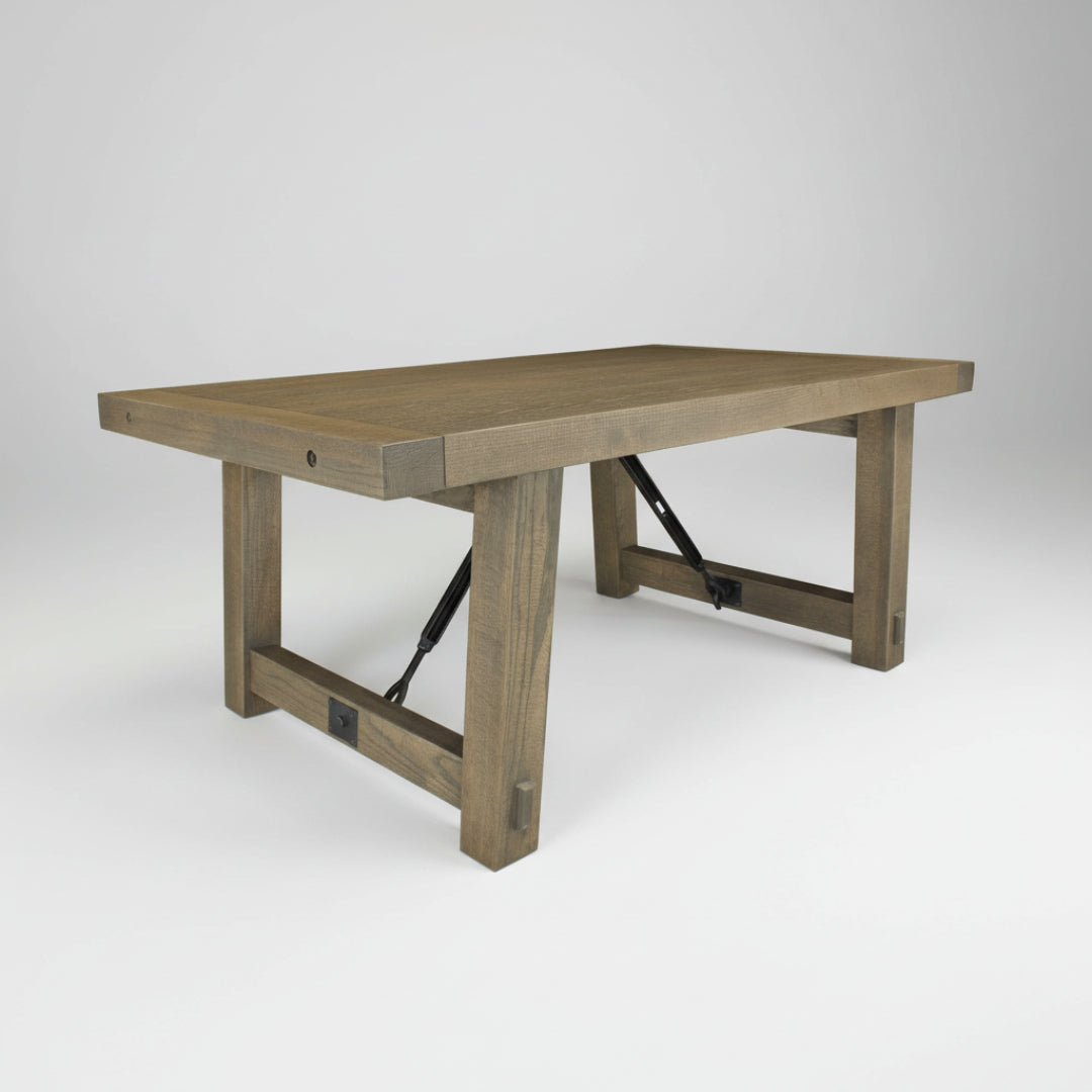 A Yukon Trestle Table with a rectangular built-up top and a double turnbuckle design with bolt accents, made of Canadian solid wood.