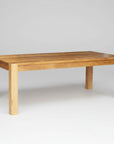 A rectangular Canadian-made solid wood harvest table with square legs.