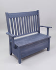 A rustic blue Dakota slat back storage bench made of solid wood, with a bench seat and backrest.