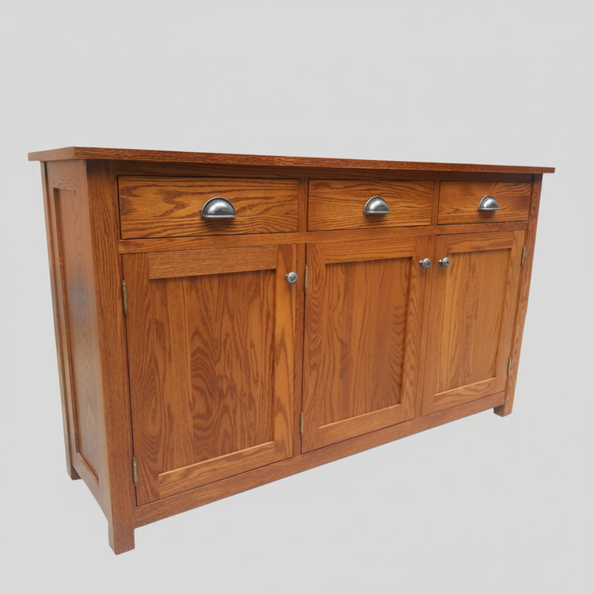 A brown wooden sideboard with three drawers and three doors, featuring metal handles and a smooth wood texture.