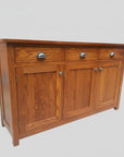 A brown wooden sideboard with three drawers and three doors, featuring metal handles and a smooth wood texture.