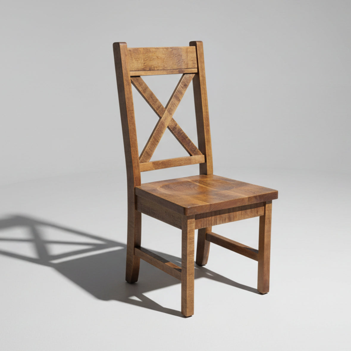 A Klondike chair made of solid wood with a crossback design and a flat seat.