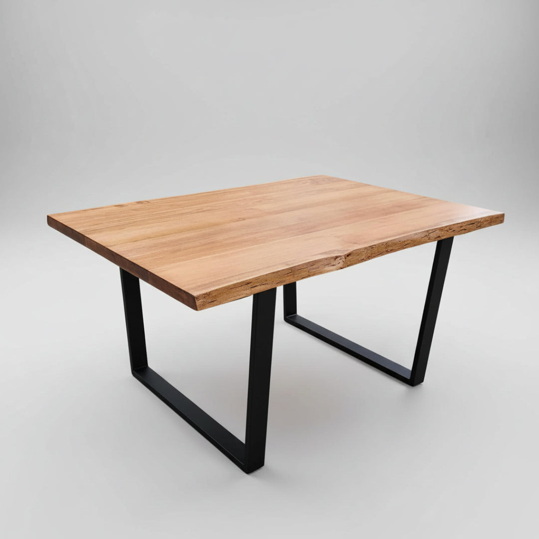 A rectangular live edge table with a smooth wood texture and black metal legs.